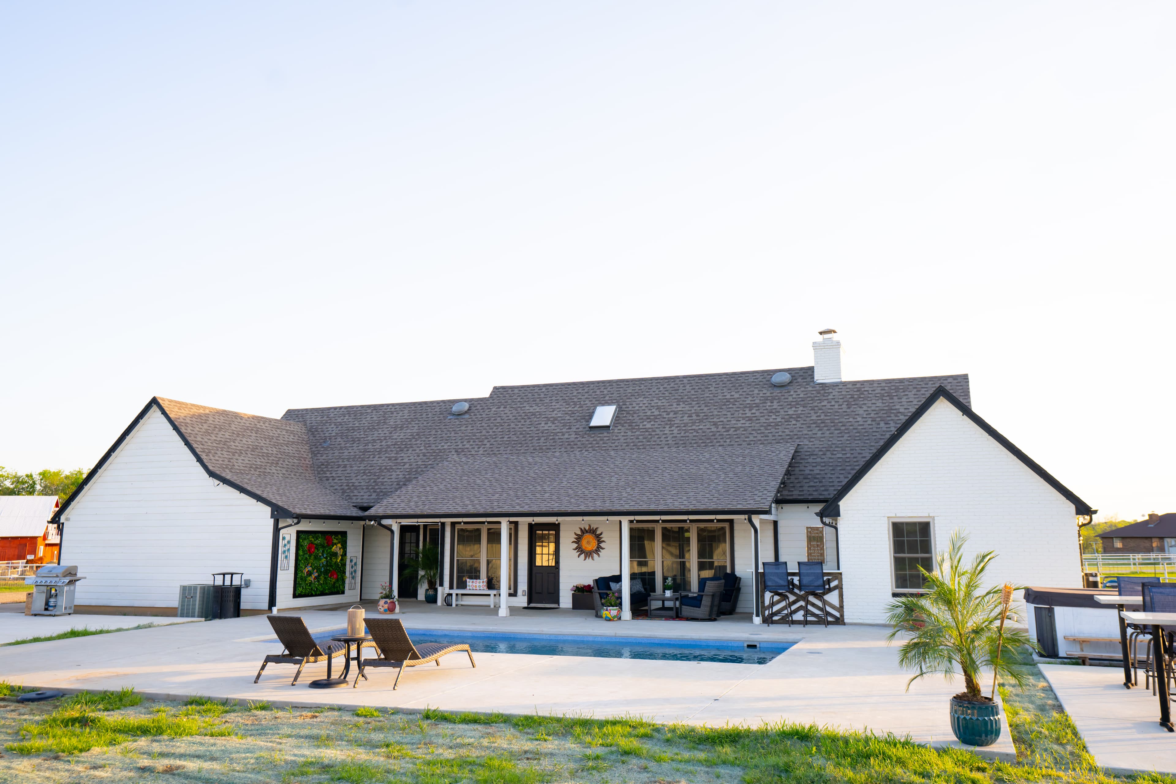 the white farmhouse with pool
